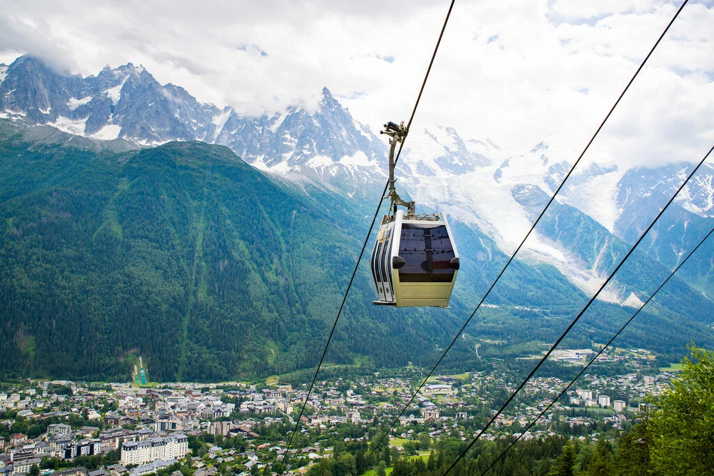 Cable car traveling over Chamonix in Mont Blanc area